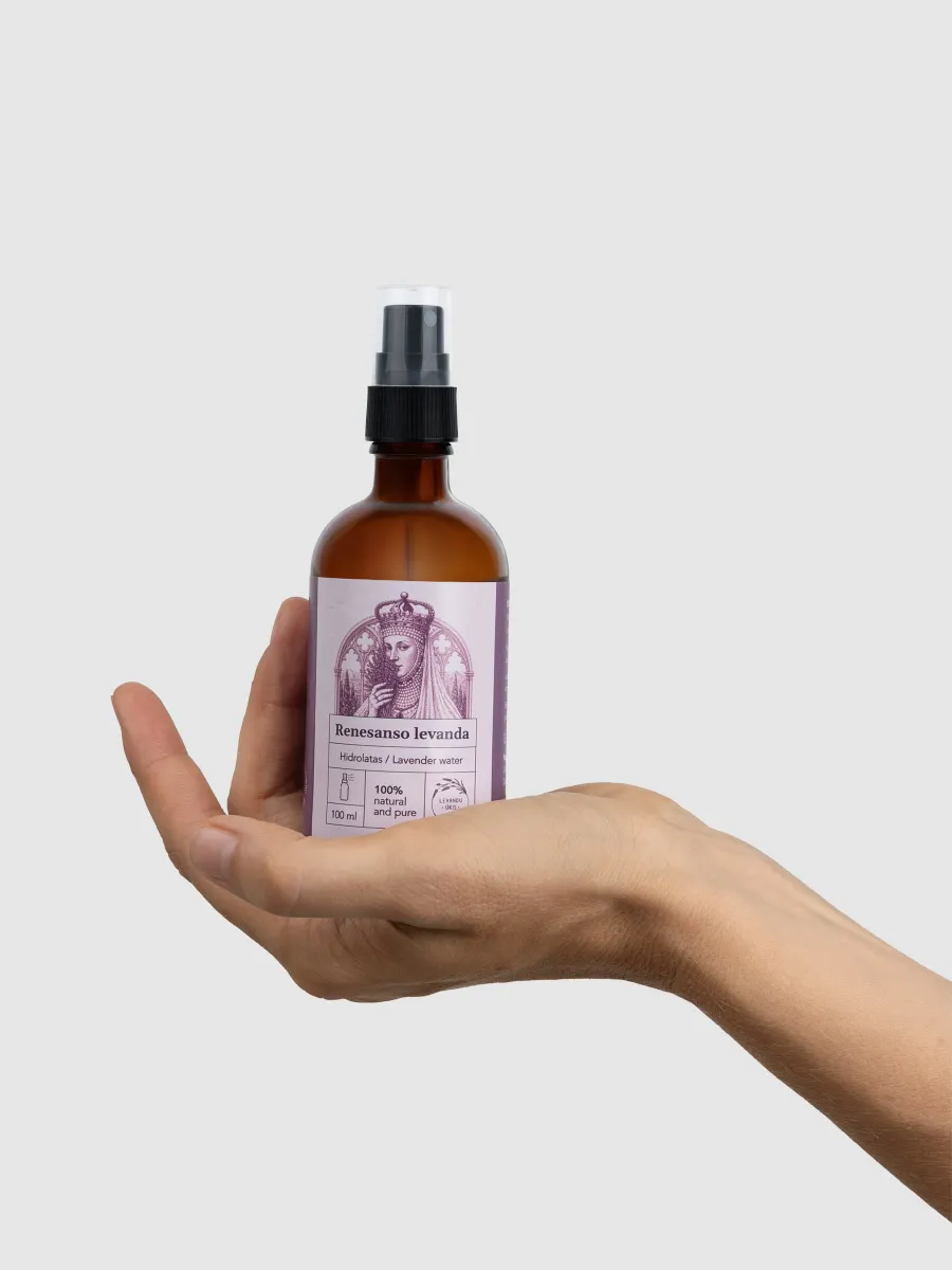 “Renaissance Lavender” lavender hydrosol in a brown glass spray bottle, held in the palm