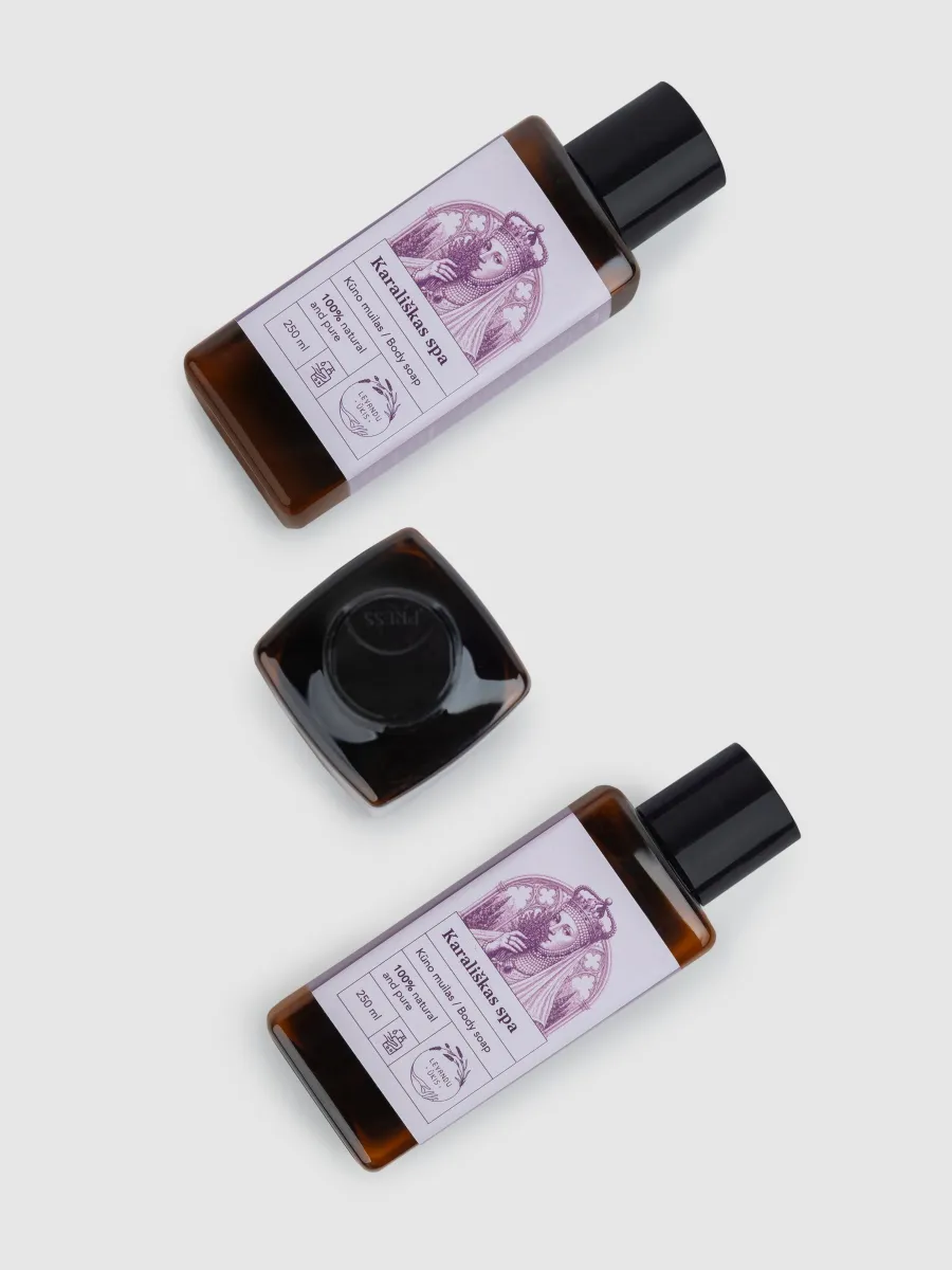 Two bottles of “Royal SPA” lavender body wash lying with the cap off, top view